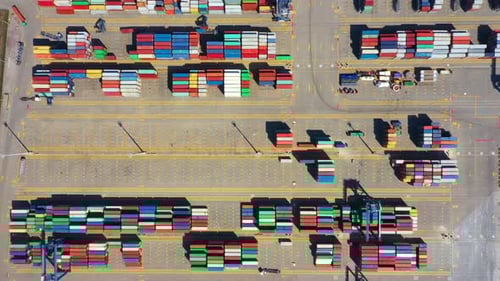 Container ship in export and import business and logistics. Shipping cargo to harbor by crane. Water