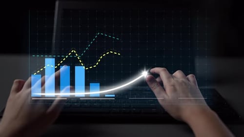 Hands manipulating digital screen with stock market data, showing growth and analysis with graphs an
