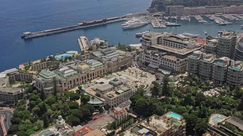 Monaco Aerial v15 birds eye view drone flying around monte carlo casino square, capturing downtown c