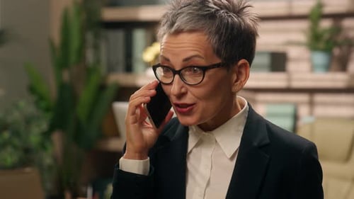 Portrait in Office Happy Emotional Talking Amazed Wonder Surprised Shocked Gray Haired Elderly