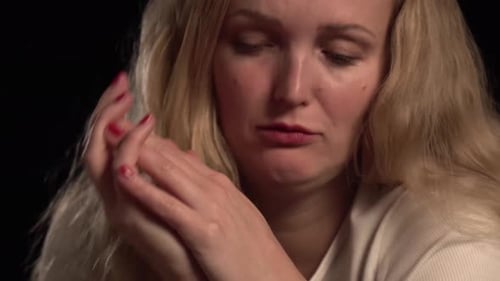 Distraught Woman Crying with Tears Running Down Face