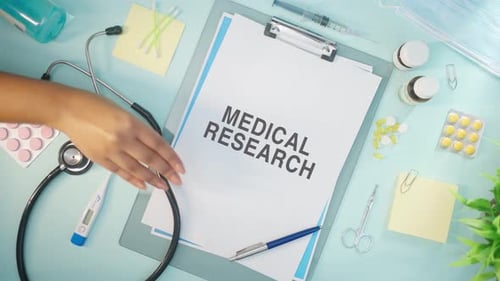 Medical Research Workspace with Stethoscope and Supplies