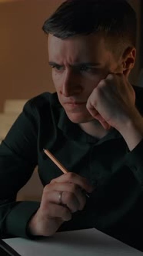Vertical of Caucasian Male Thinks About Solving Hard Mathematic Equation in Studying