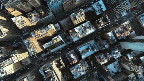 Slow cinematic overhead drone glide over Midtown, sunny day in New York city