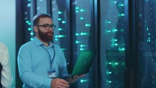 IT Professionals Working in Modern Server Room