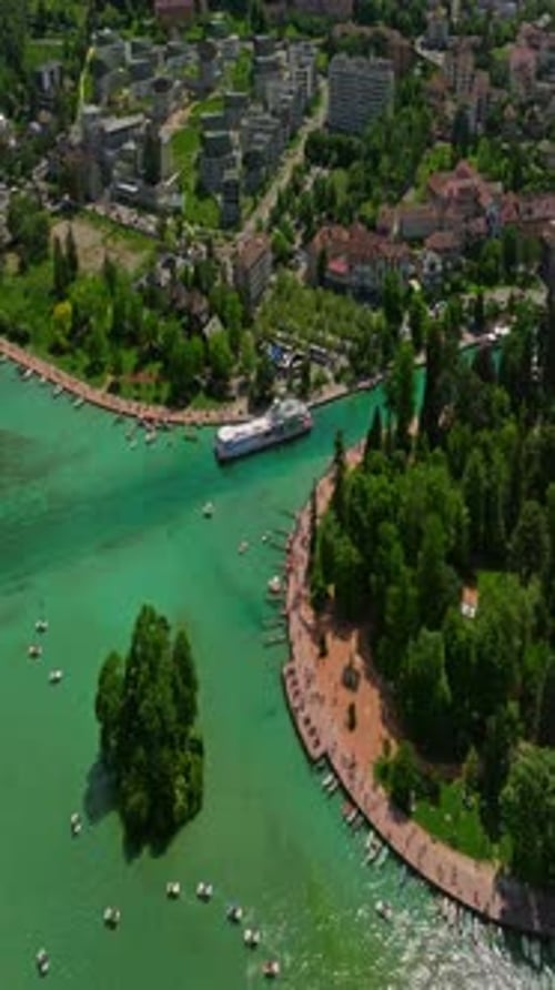 Old Town Center of Annecy and the River Thiou with Tourists Visiting An Emblematic River of Annecy