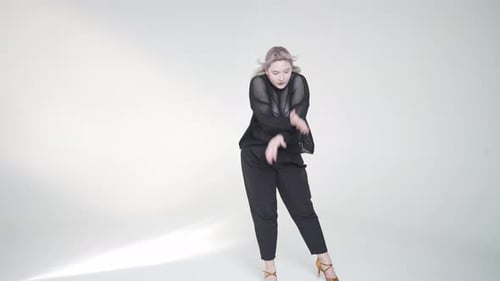 Woman with Purple Hair Dances in Studio