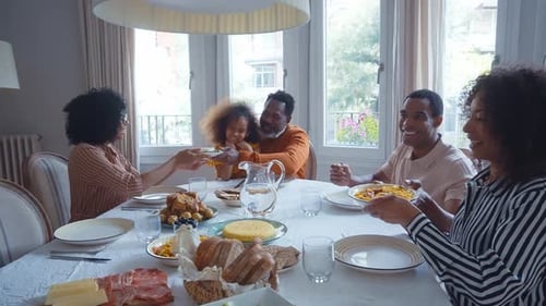 Happy Family Eating Together at Home