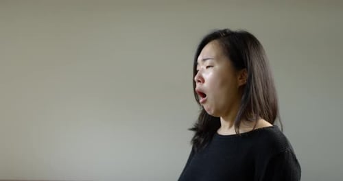 Asian Woman Coughing With Corona Virus B