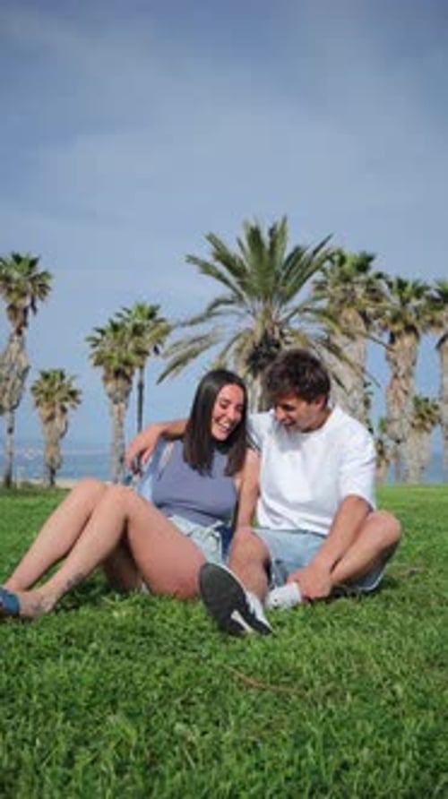Smiling Couple Enjoying a Sunny Day at the Beach