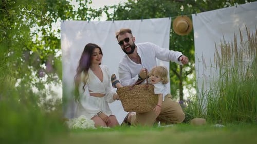 Happy Family Picnic in the Summer Garden