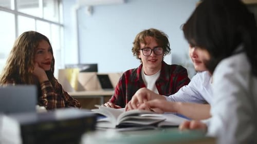 Diverse students collaborating on a group project in a university library