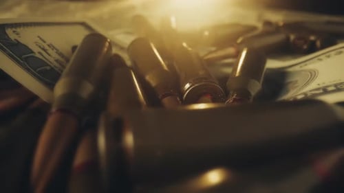 Ammunition and Currency in Golden Light Close Up