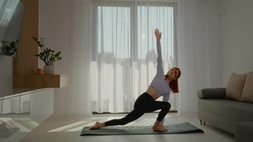 Woman Practicing Yoga at Home on Sunny Day