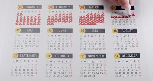 Marking Days Off on a Calendar with Marker