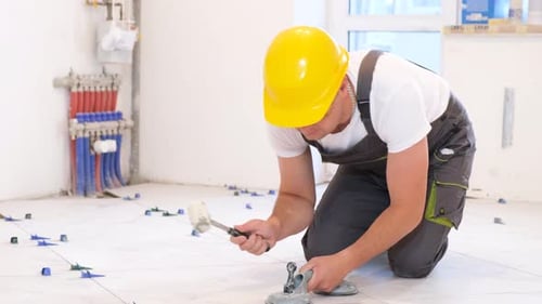 Tiler Installs Ceramic Tiles Indoors