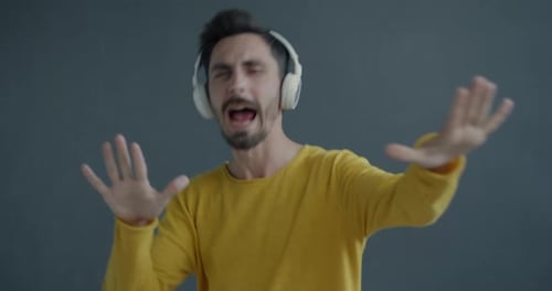 Man Listening to Music Dancing with Headphones