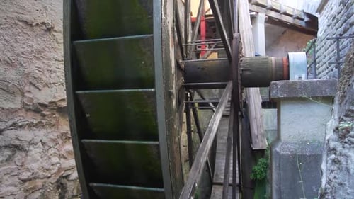 Slow motion shot of a rotating Wooden Wheel from an Old Water Mill in Meersburg, Germany