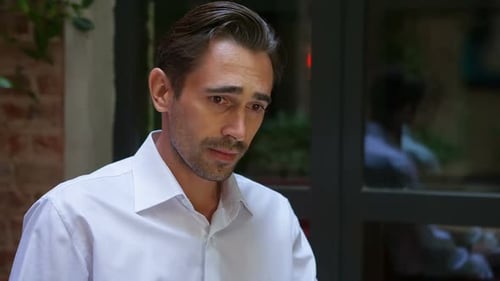 Man in White Shirt, Somber Portrait Close-up