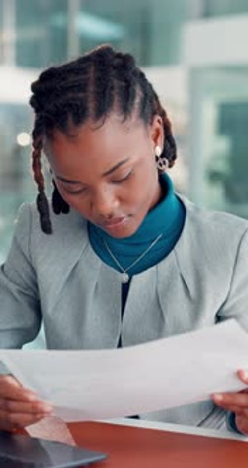 Business, black woman and reading document in office for accounting, finance report and statistics