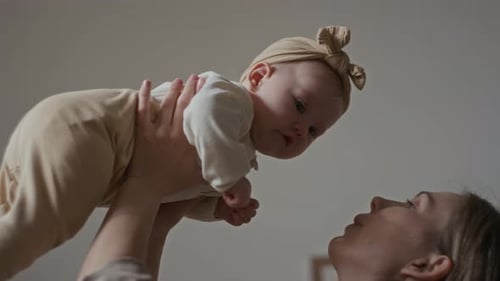 Loving Mother Holding Her Beautiful Baby