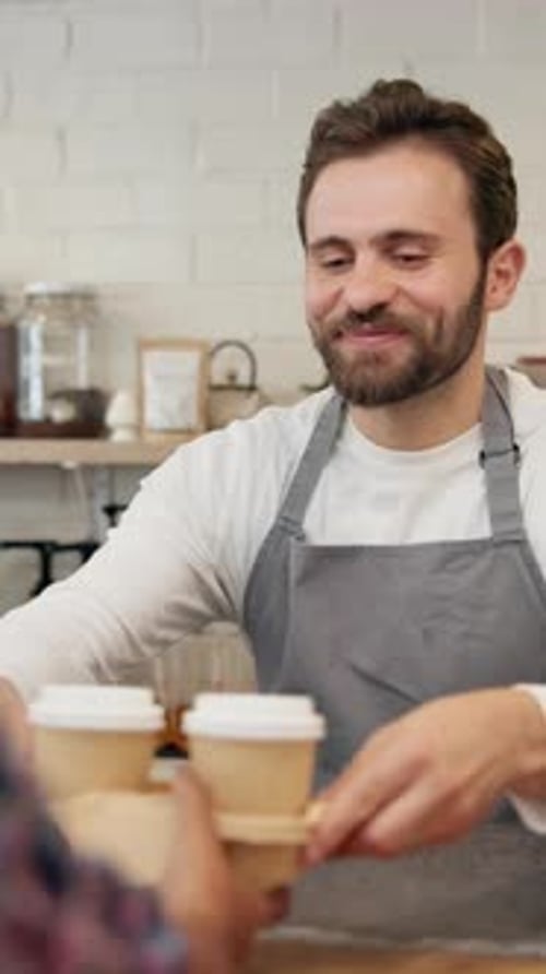 Coffee, man and barista serving in cafe for customer service, hospitality or career in morning
