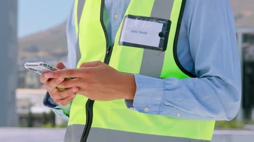 Phone, engineering or hands typing on construction site planning real estate building in city