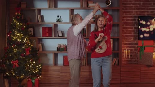Senior Couple Dancing at Christmas in Home