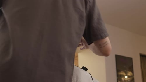 Barber Styling Dark Brown Hair in Shop