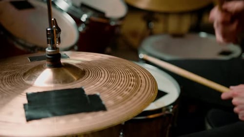 drummer plays a drum kit in a recording studio at a professional musician rehearsal recording a song