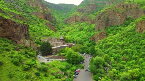 Geghard is medieval monastery in Armenia, carved into nearby mountain.