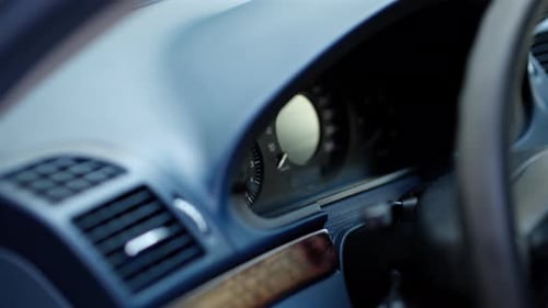 Close up of the dashboard and steering wheel of a car