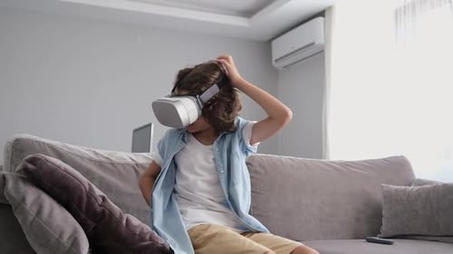 Child Exploring Virtual Reality on Couch