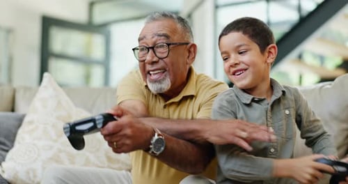 Happy Boy and Man Play Video Games at Home