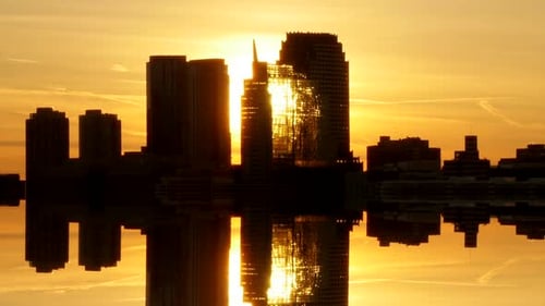 Cityscape Skyline Reflecting During Golden Hour