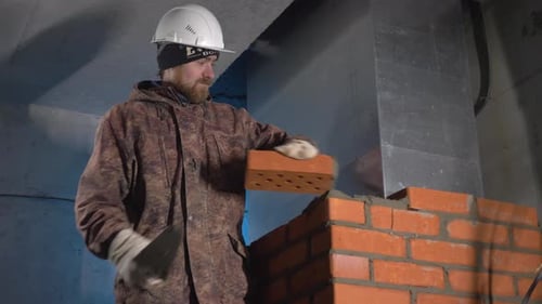 Repair and construction work. Clip. A young team working with cement and material to promote