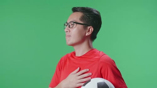 Man with Soccer Ball Reciting Pledge