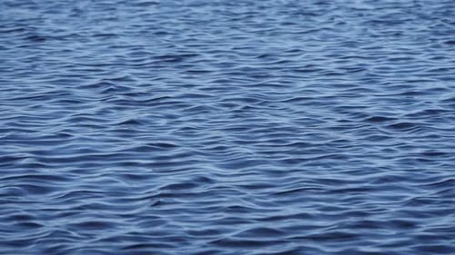 Lake Water Surface Reflecting Ambient Light Slow Motion
