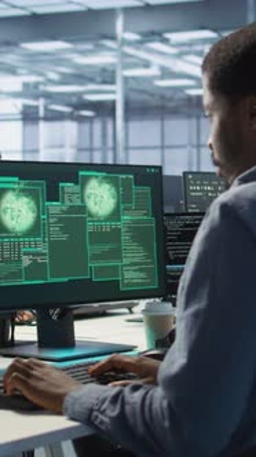 Vertical Video Cybersecurity Team Monitoring Security Incidents Affecting Data Center