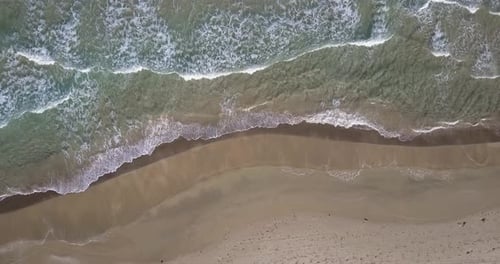 Sea waves and empty beach flight