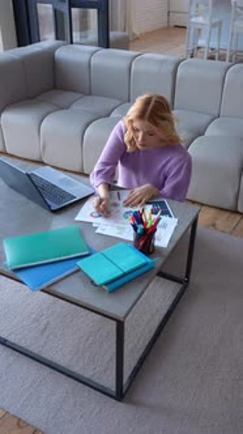 Focused Girl High School Student Learning and Preparing for Exam at Home