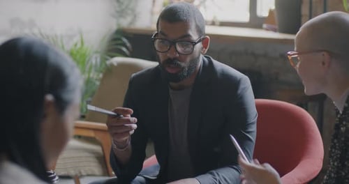 Adults Collaborating in a Workplace Meeting
