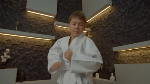 Determined Multiracial Karate Kid Training Karate Punching Techniques