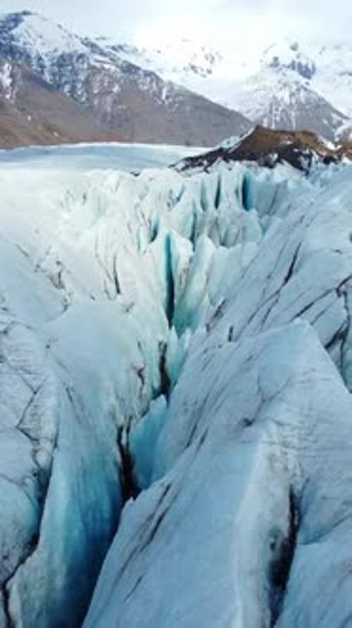 Vertical Screen Vatnajokull Glacier in Iceland Pure Blue Ice Winter Landscape Aerial View Largest