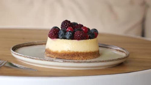 Mini Cheesecake Garnished with Fresh Berries on Plate