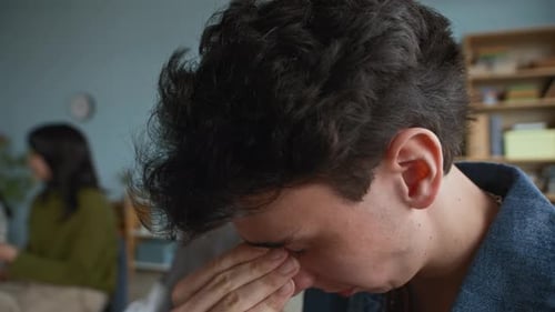 Frustrated Young Adult at Work