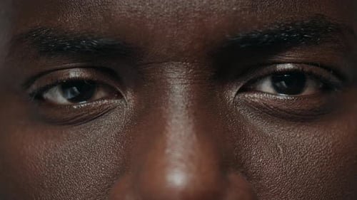 Extreme Closeup African American Man Eyes. Young Guy Clapping Eyes Macro. Close