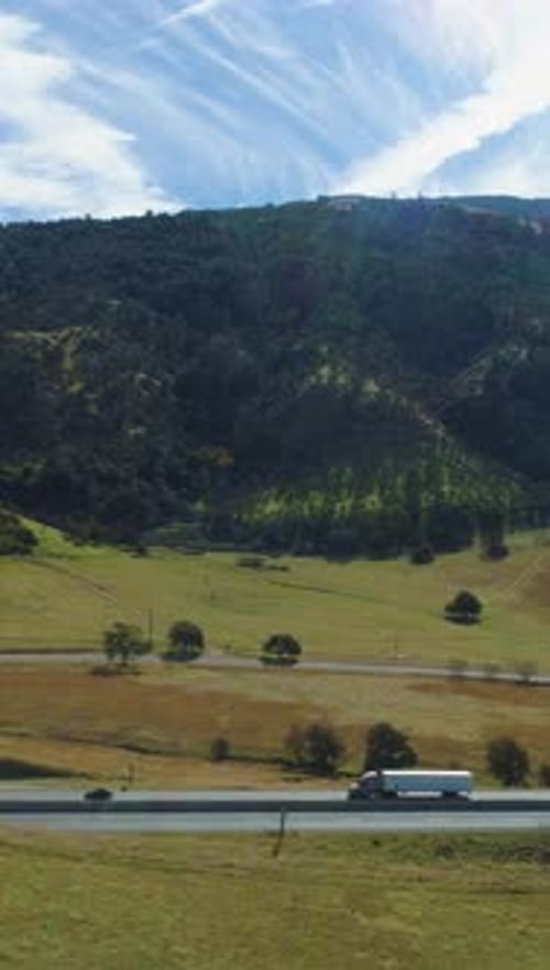 Highway 51 and Green Meadow with Hills Kern County California USA Aerial View Vertical Video