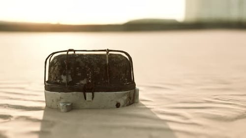 Old Rusted Trash on the Sand Beach