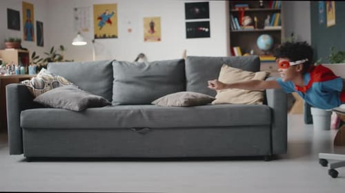 Child and Adult Playing Superhero in Home